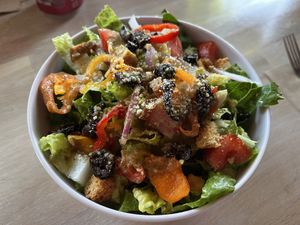 half an order of salad (one of two bowls)  at Secret Pizza Society in Portland