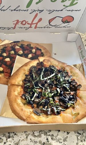 Take out! Mushroom/olive & pesto at Secret Pizza Society in Portland