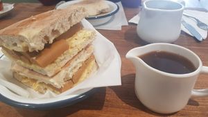 Vegan saveloy and pot of gravy at Sea Change  in South Shields