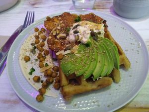 Sour dough waffle with advocado and hummus at Wholywood in Paris
