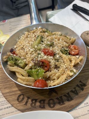 Vegan pasta with vegan cheese on top  at Marrobbio in Sliema