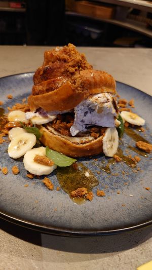 Cinnamon bun with ice cream, banana, biscoff... at Gives a Fork in Geneva