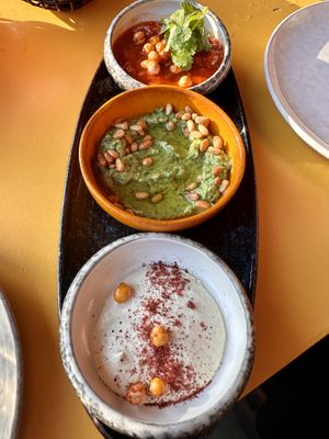 Dips (harissa, white bean pesto and yoghurt tahini)  at Pele Surf Shack in Hook Of Holland
