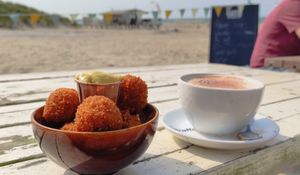 Bitterballen with mustard and a Chai latte at Pele Surf Shack in Hook Of Holland