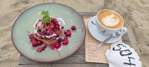 Pancakes with a decaf cappuccino at Pele Surf Shack in Hook Of Holland