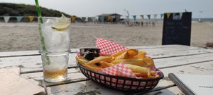 Delicious fries with mayo and a Yuzu vanilla lemonade at Pele Surf Shack in Hook Of Holland