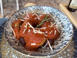 Vegan meatballs on homemade tomato sauce with bread  at Pele Surf Shack in Hook Of Holland