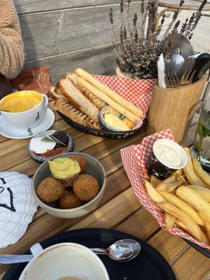 Bread basket with tapenade and butter, fries with mayo and bitterballen (oma bobs)  at Pele Surf Shack in Hook Of Holland
