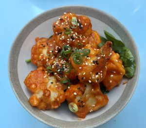 Cauliflower appetizer: cauliflower battered in rice flower, in a sweet and sour sticky sauce   at O Gambuzino in Lisbon