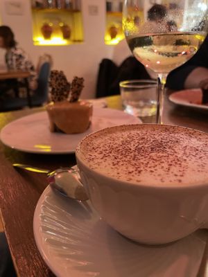 Cappuccino with vegan cheesecake   at O Gambuzino in Lisbon