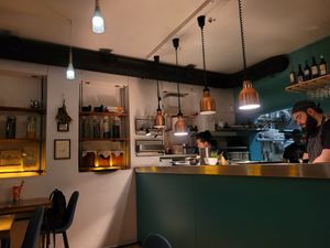 Chefs preparing food in the room at O Gambuzino in Lisbon