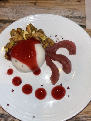 Panna cotta with caramelised pistachios, poached pear and hibiscus gel  at O Gambuzino in Lisbon