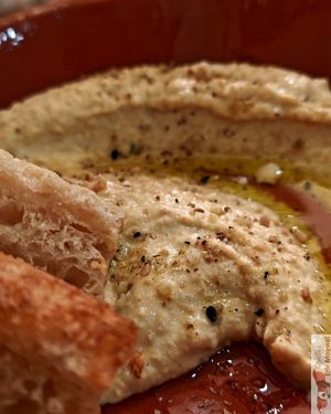 hot focaccia bread with a succulent hummus! at O Gambuzino in Lisbon