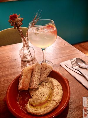 hot focaccia bread with a succulent hummus! at O Gambuzino in Lisbon