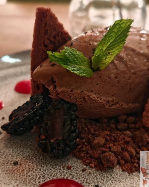 Belgian chocolate mousse, baked cocoa meringue, chocolate crumb and blackberries. at O Gambuzino in Lisbon