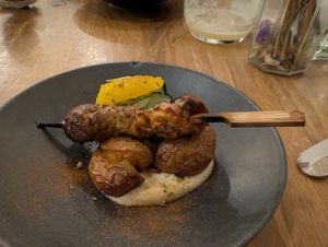 'Lamb' skewer on roasted potatoes at O Gambuzino in Lisbon