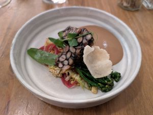 Black bean tempeh with a peanut sauce and medley of veg at O Gambuzino in Lisbon
