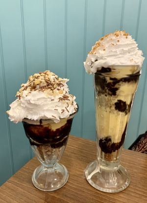 Double choc and nut sundae on the left and lotus sundae on the right   at Cadwaladers in Tenby