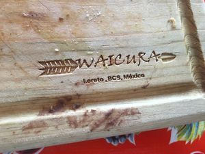 They serve their food on these wooden platters. Good, no plastic waste! at Waicura in Loreto