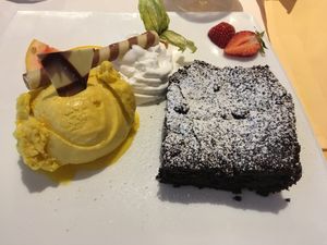 Brownie, mango sorbet and vegan whipped cream at Schröders at Kurhaus am Inselsee in Guestrow