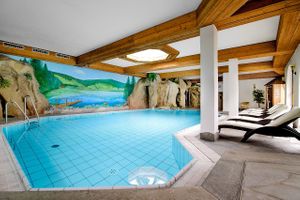 indoor rock pool with waterfall at Holzschuh's Schwarzwaldhotel in Baiersbronn