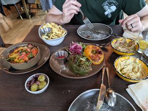 Vegan mousakka, stuffed peppers, fries, and olives at BAAB in Oban