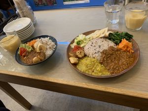 Small mushroom curry and large mushroom curry with set mango lassi at Kumeys in Tokyo