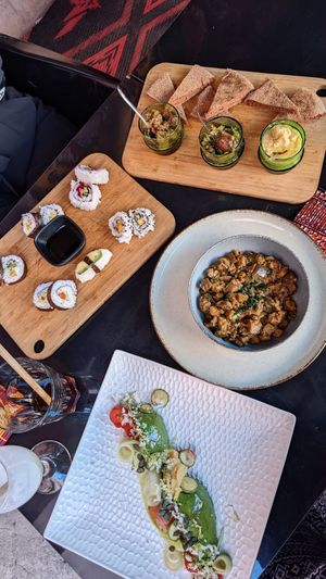 Spread assemble, sushi, eggplant salad, and avocado hummus salad 🤤💚 at Broc The Kasbah in Marrakech