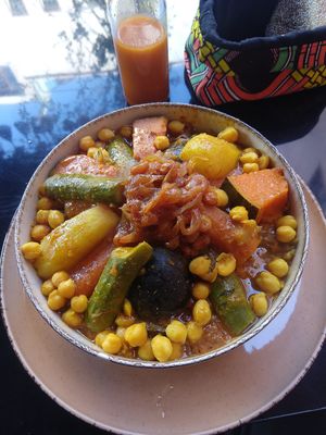 Couscous. Comes with couscous on the bottom and some chickpeas for protein. Also has carrots eggplant and a few other vegetables I can't identify at Broc The Kasbah in Marrakech