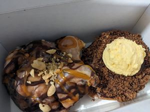 Snickers fritter and Nanaimo donut at Machino Donuts - Bloor St in Toronto