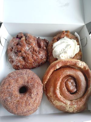 Apple fritter, carrot cake, cinnamon cronut, apple cider roll at Machino Donuts - Bloor St in Toronto