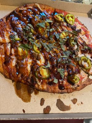 Beyond meat, vegan cheese, jalapeños, Kalamarz olives, basil, bbq drizzle, sriracha, balsamic drizzle  at Oath Pizza in New York City