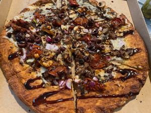 Beyond meatballs, vegan cheese, Kalamarz olives, roasted garlic, roasted cherry tomato, mushrooms, red pepper flakes, balsamic drizzle.  at Oath Pizza in New York City