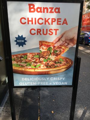 Placard advertising Vegan, gluten free pizza. at Oath Pizza in New York City