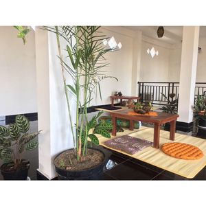 Upstairs seating area and the kitchen- view over central Ubud with sunset at Urban Jungle in Ubud