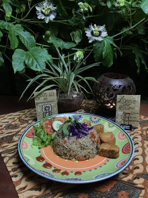 New! Nasi Goreng Lada Hitam (Fried rice with black pepper, mushroom, paprika and vegetables, served with fried Tofu and Temphe and some raw vegetables.  at Urban Jungle in Ubud