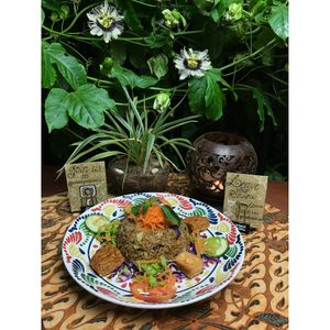 New! Nasi Goreng Kampung (Fried rice with soy sauce, Oncom and vegetables, served with fried Tofu and Temphe and some raw vegetables.  at Urban Jungle in Ubud