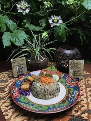 New! Nasi Goreng Kencur (Fried rice with fresh herbs and vegetables, served with fried Tofu and Temphe and some raw vegetables.  at Urban Jungle in Ubud