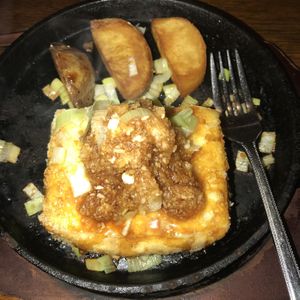 Tofu steak! With potatoes. All very yummy! Comes out on a sizzling platter   at Gotoku-tei in Nagano