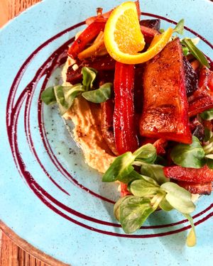 Roasted vegetables served over homemade hummus with local honey.  Please specify if you would like this dish to be prepared vegan.    at Fig in Split