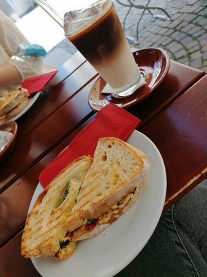 Panini mit Hummus und Grillgemüse. Iced-Hafer-Latte at Café Pavillon in Loerrach
