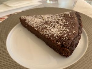 Delicious chocolate fudge tart... tasted like a brownie with a chocolate crust.  at Milokidono in Aegina