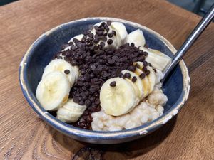 Vegan chocolate and banana oatmeal bowl  at Haferkater - S-Bf Friedrichstraße in Berlin