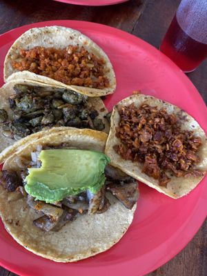 Tacos de carnitas (extra de aguacate), chicharrón y chorizo verde y rojo  at El Bajón Vegano in Tulum