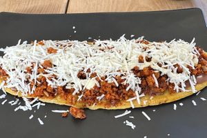 Huarache with red “chorizo” (as served, before dressing it up)  at El Bajón Vegano in Tulum