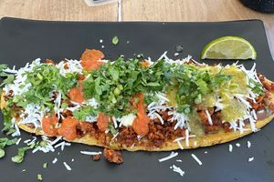 Huarache after adding salsas and cilantro  at El Bajón Vegano in Tulum