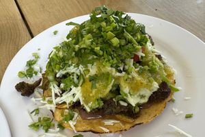 Tostada after adding salsa and cilantro  at El Bajón Vegano in Tulum