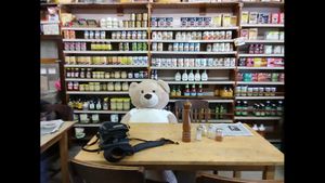Everyone's welcome at the communal tables. This guy caught a ride with a few of his humans. (Pets are welcome on the patio, and service animals inside.) at Oh Happy Days Vegan Cafe in Altadena