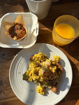 Vegan banana muffin, avocado toast with tofu scramble, orange juice.  at Harvest on 25th in Waco