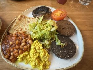 Vegan breakfast, including mushrooms, tomato, potato bread, tofu scramble, vegan black pudding, vegan haggis, (homemade!) baked beans and cabbagee  at Loudons Cafe and Bakery - New Waverley in Edinburgh